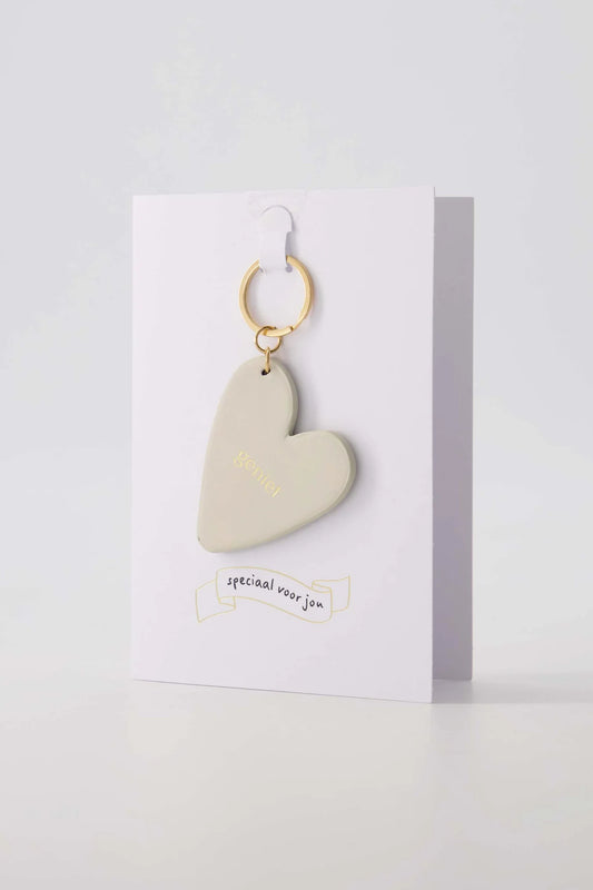 Zusss Wenskaart Sleutelhanger Geniet zand